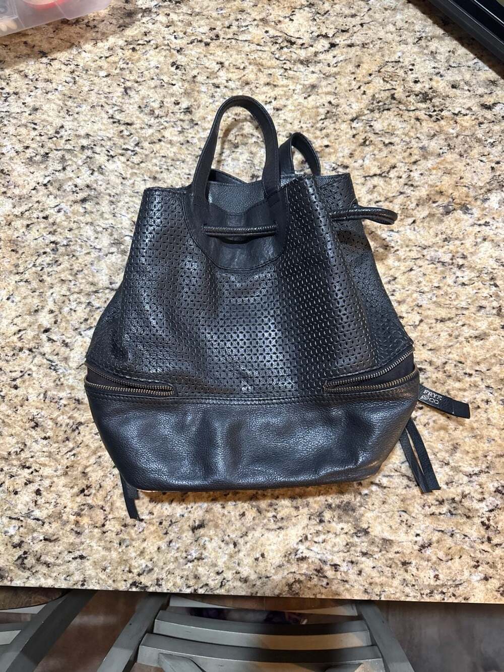 Frye and Co. Anise Black Perforated Leather Drawstring Backpack